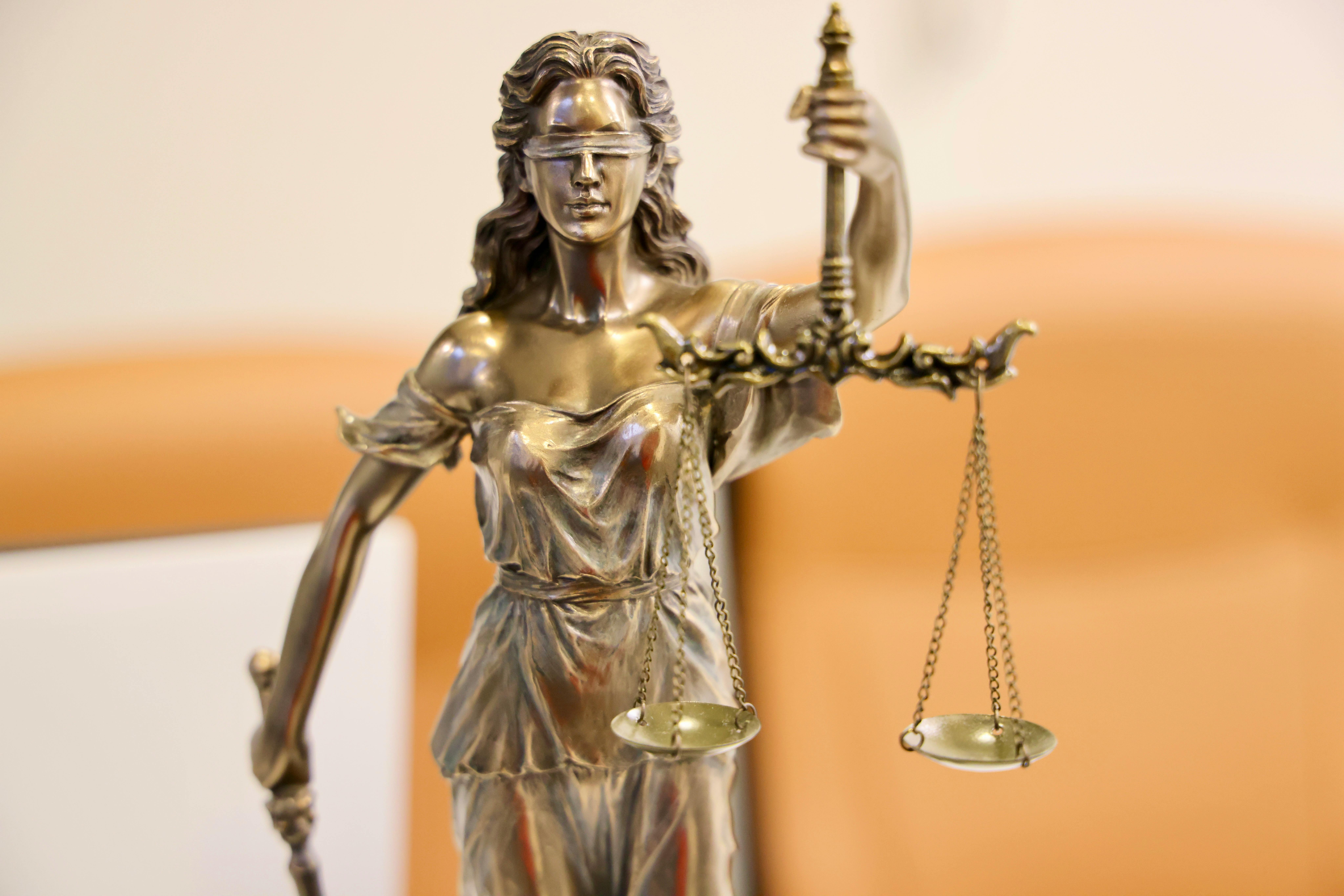 Justice with Her Scales and Sword